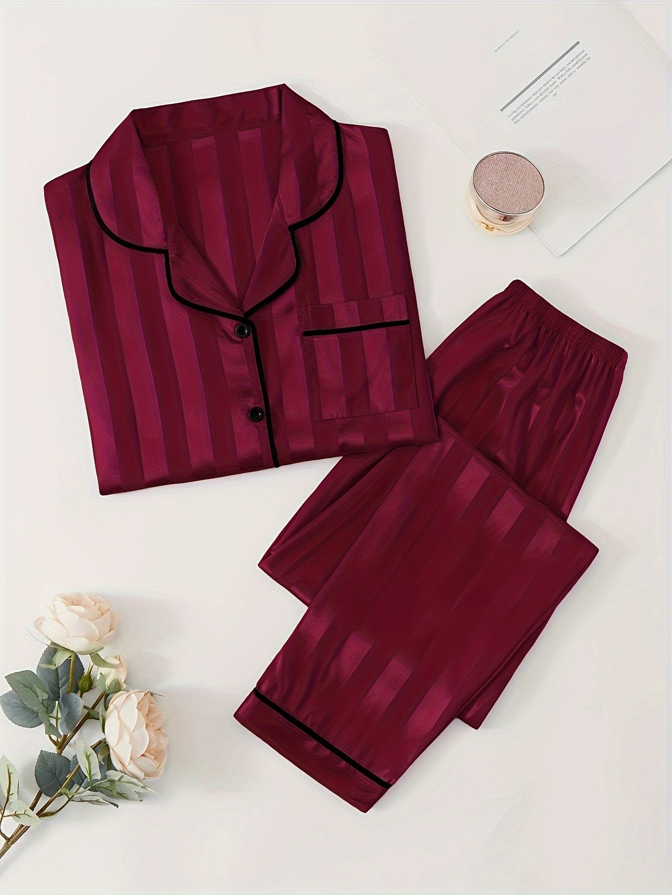 Women's satin pajama set with striped long sleeve top and lounge pants for sleepwear and loungewear.