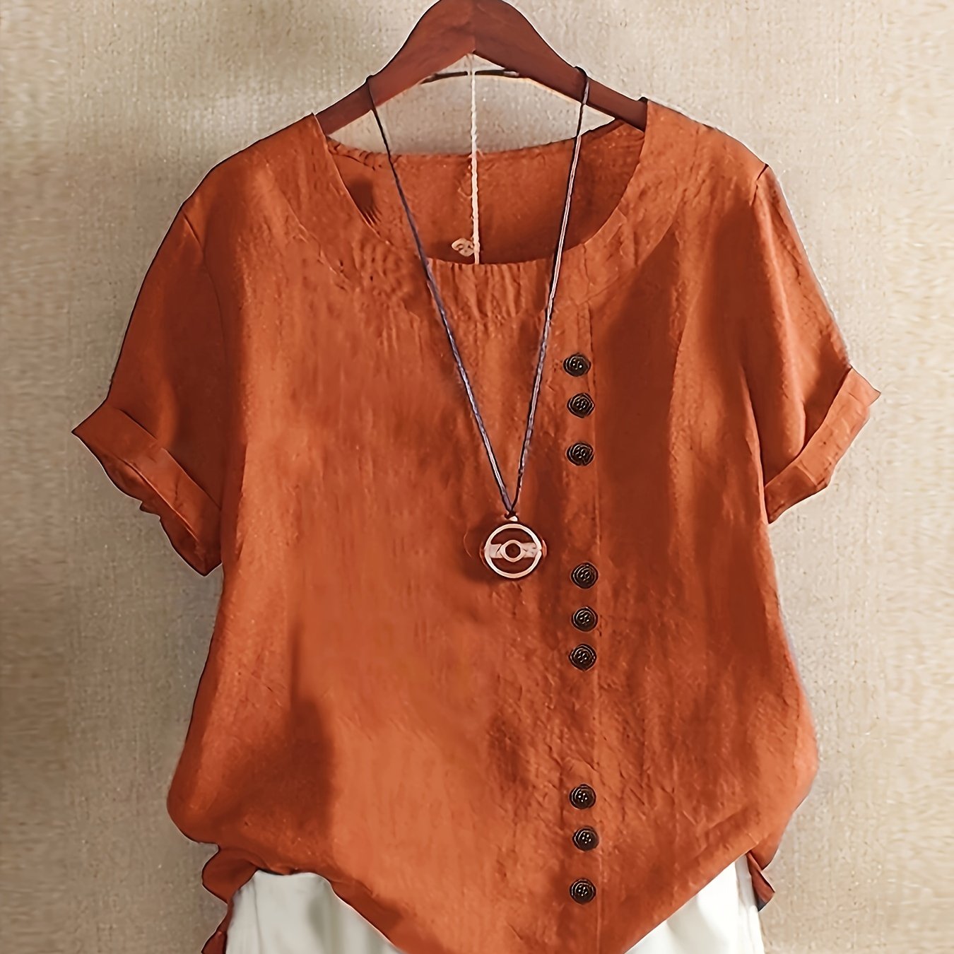 Stylish cotton button-up shirt in solid color, ideal for spring/fall