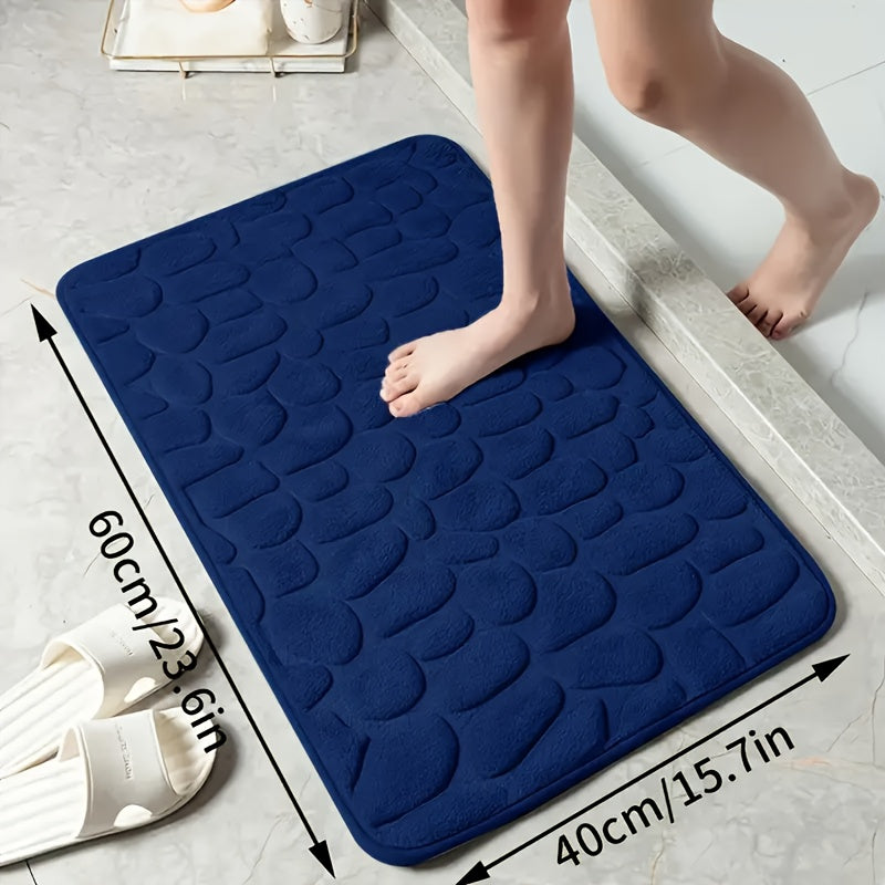 Luxurious red memory foam bath mat with geometric pattern for bathroom floors. Non-slip, soft polyester material that is quick-drying and absorbent. Hand washable, fragrance-free with a textured surface and machine-knit design. Perfect for a quick dry