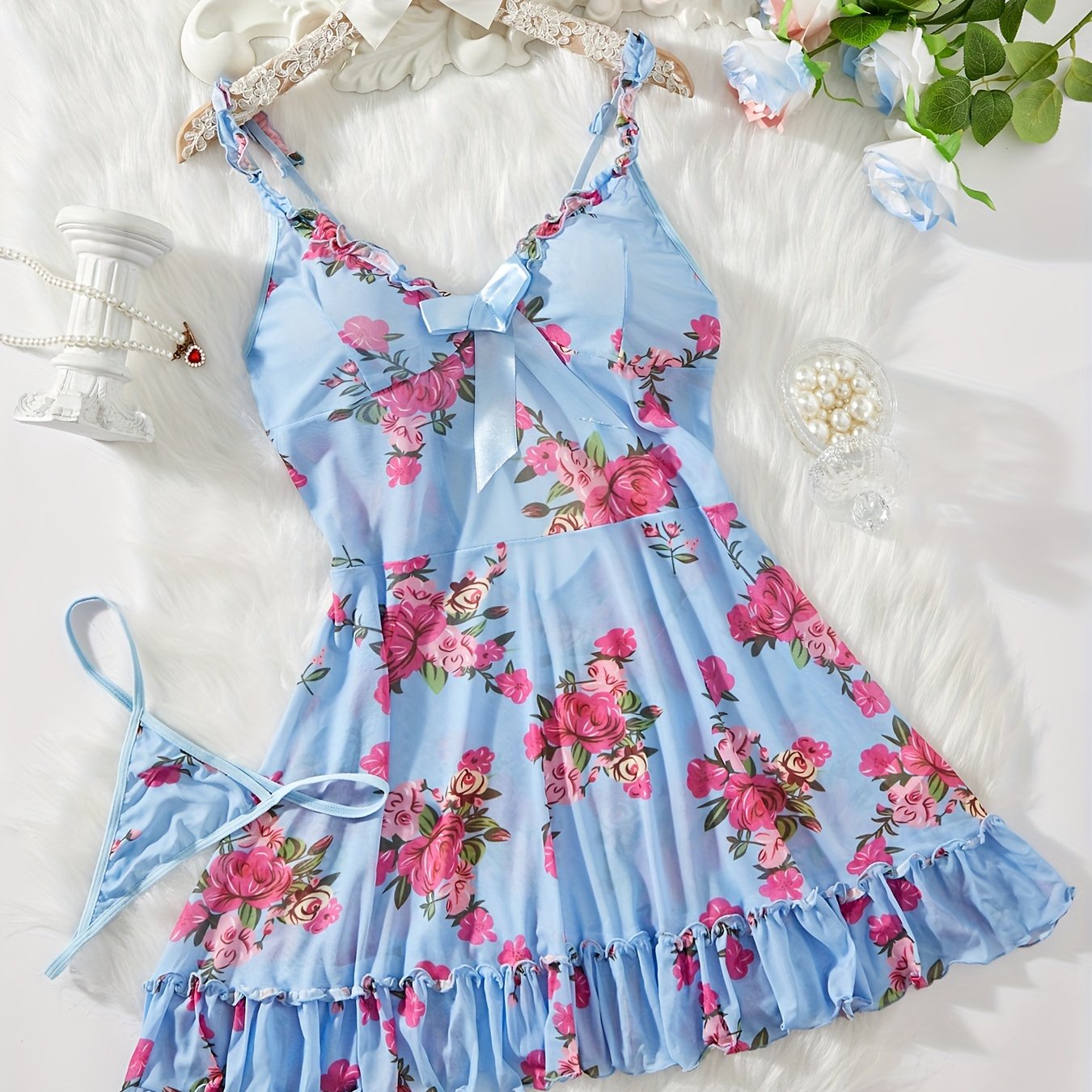 Floral print two-piece sleepwear set with ruffle hem and adjustable straps includes lingerie night dress and matching thong for women.