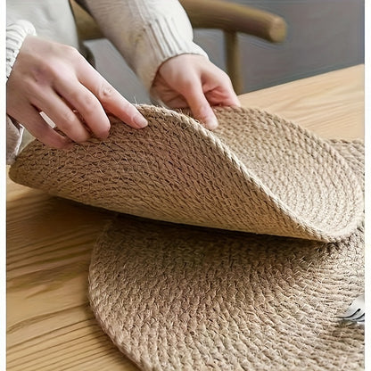 Hand-woven Japanese-style jute placemat for dining table, featuring insulation and serving as a bowl, pot holder, and cup coaster.