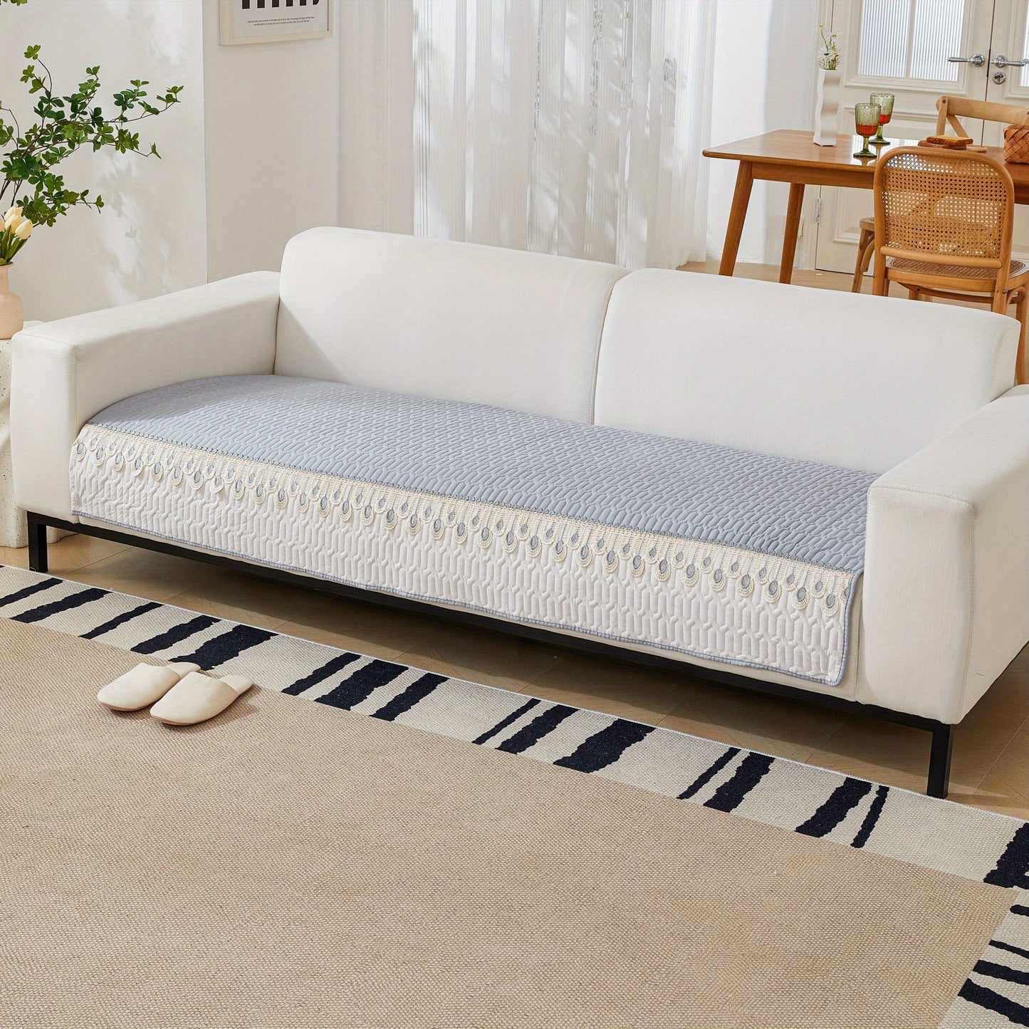 Luxurious Feather Embroidery Quilted Sofa Cover enhances and protects your couch.