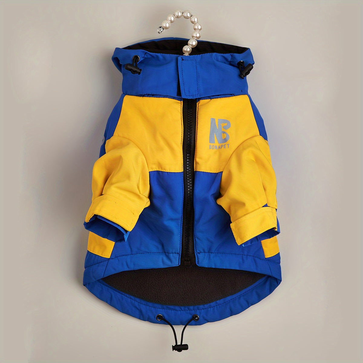 Reflective winter jacket for pets with color block design.