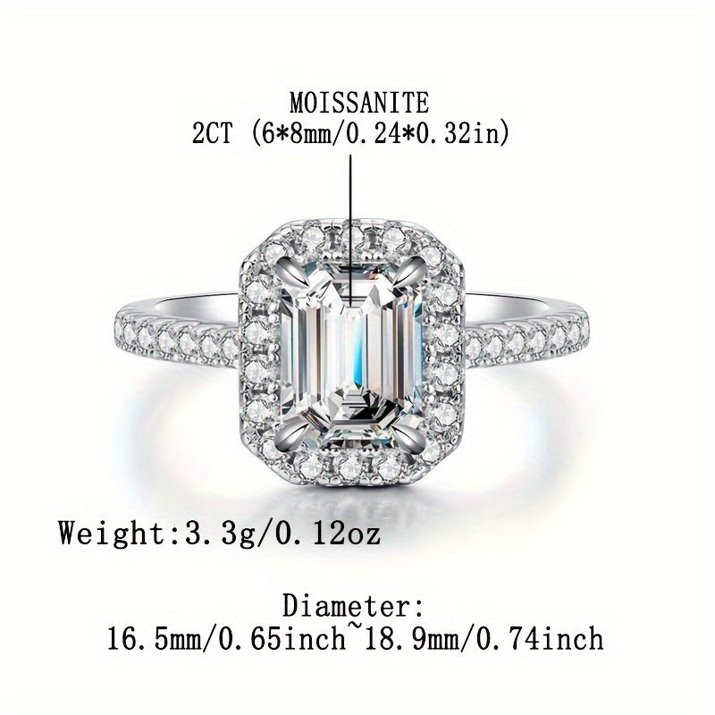 Graceful 925 Sterling Silver Plated Moissanite Engagement Ring for Women, Featuring a Stunning 2 Carat Emerald Cut Stone, a Promise Ring Symbolizing Eternal Love. Crafted with Hypoallergenic Materials, this Wedding Band Comes with a Certificate and