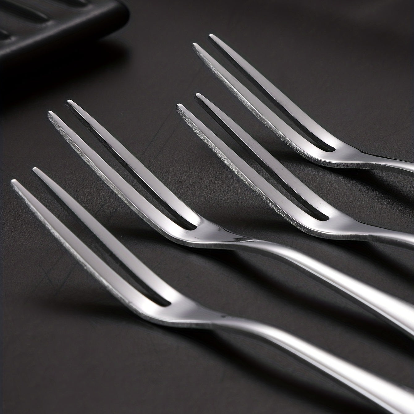 10 stainless steel fruit forks for multiple kitchen uses.