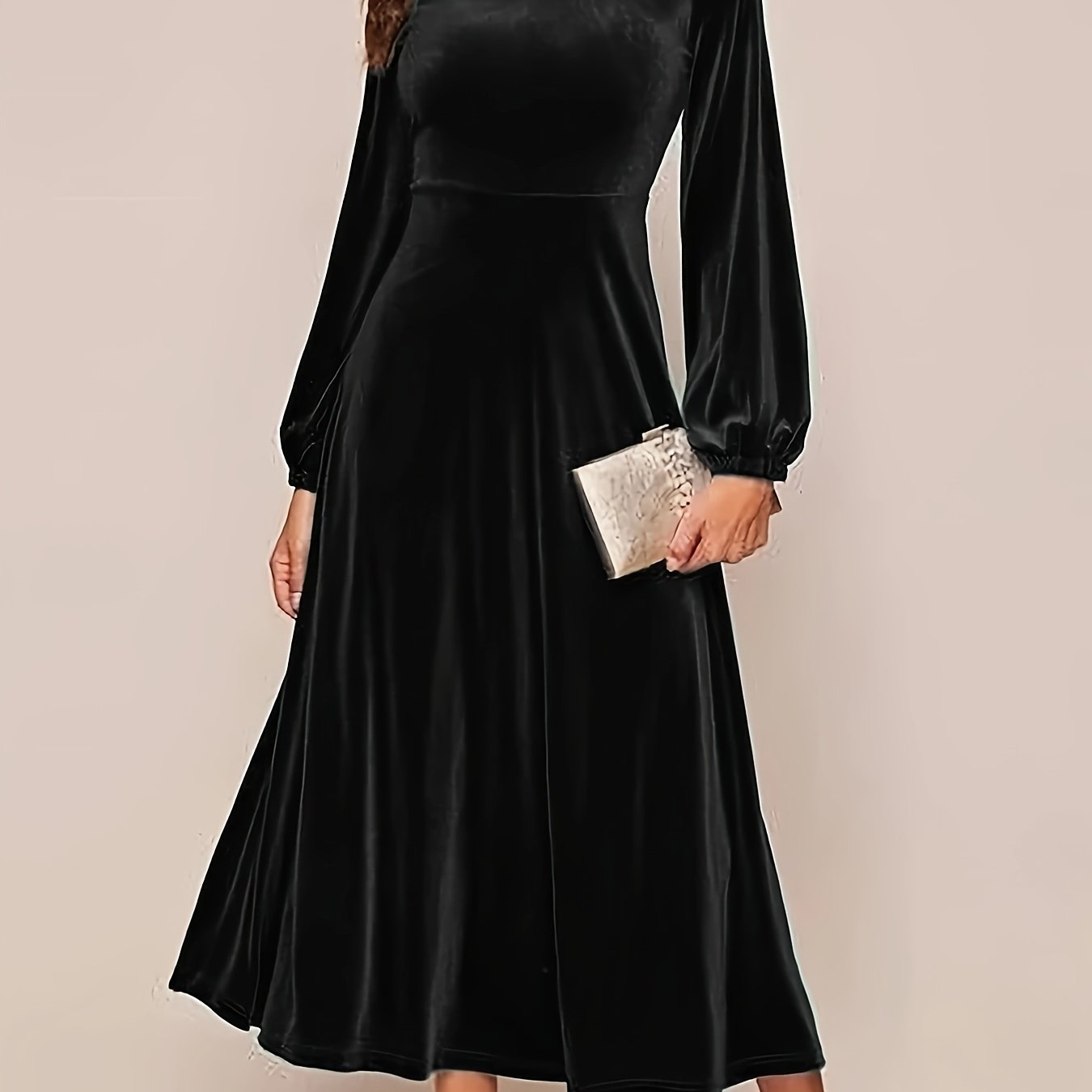 Black velvet A-line dress with flared sleeves, crew neck, and long sleeve made of polyester knit for all-season wear. Ideal for adult women's fashion as elegant attire.