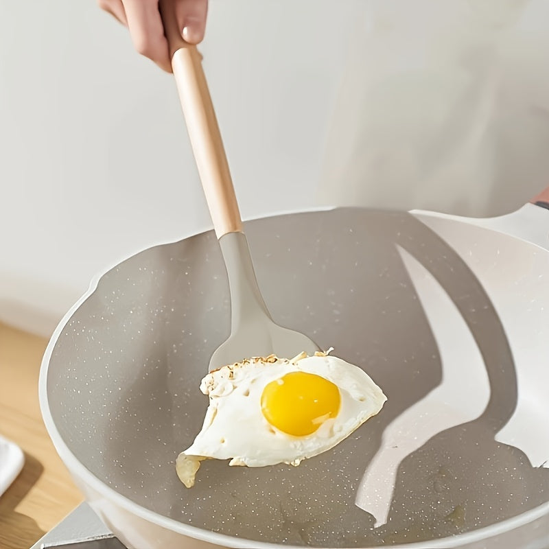 This set includes 12 pieces of silicone kitchenware with wooden handles, featuring a Japanese-inspired fresh light green and pink design. The modern, non-stick cookware set includes kitchen gadgets for a safe and hygienic cooking experience. Perfect for