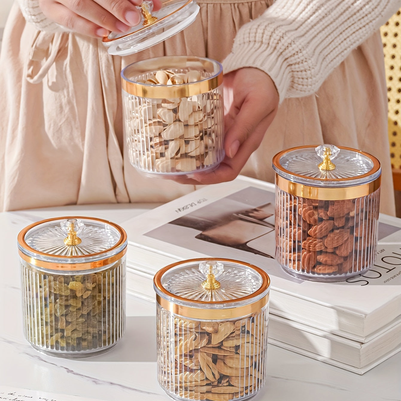 One piece of a transparent amber sketch golden grey bead decorated jar with a lid for candies. Made of plastic, can only be hand washed. It is a reusable sealed fresh-keeping box for storing cereal, rice, pasta, tea, nuts, and coffee beans. Perfect for