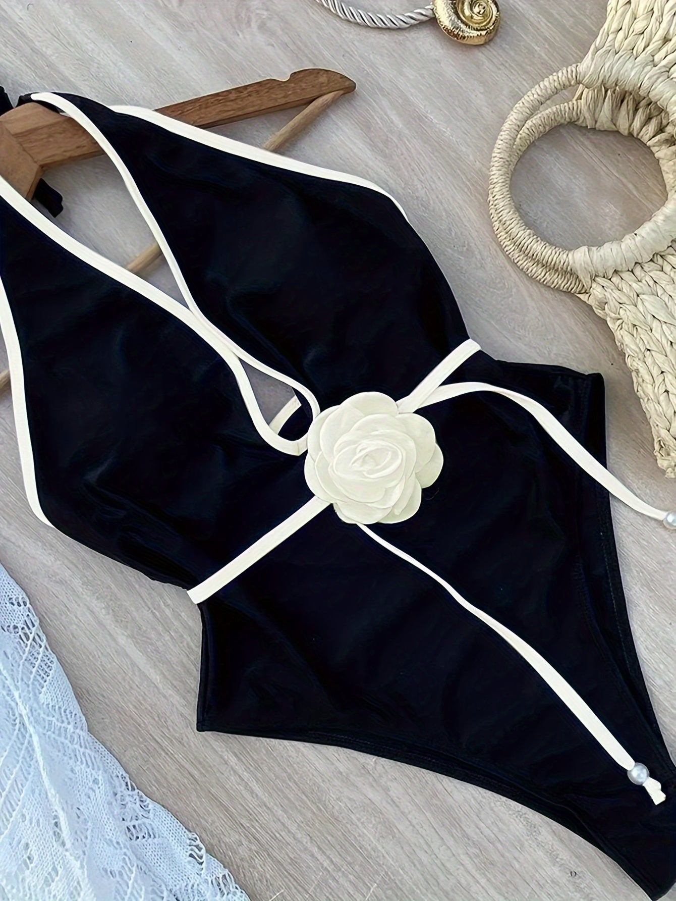 One-piece white floral tie-up beach bikini.