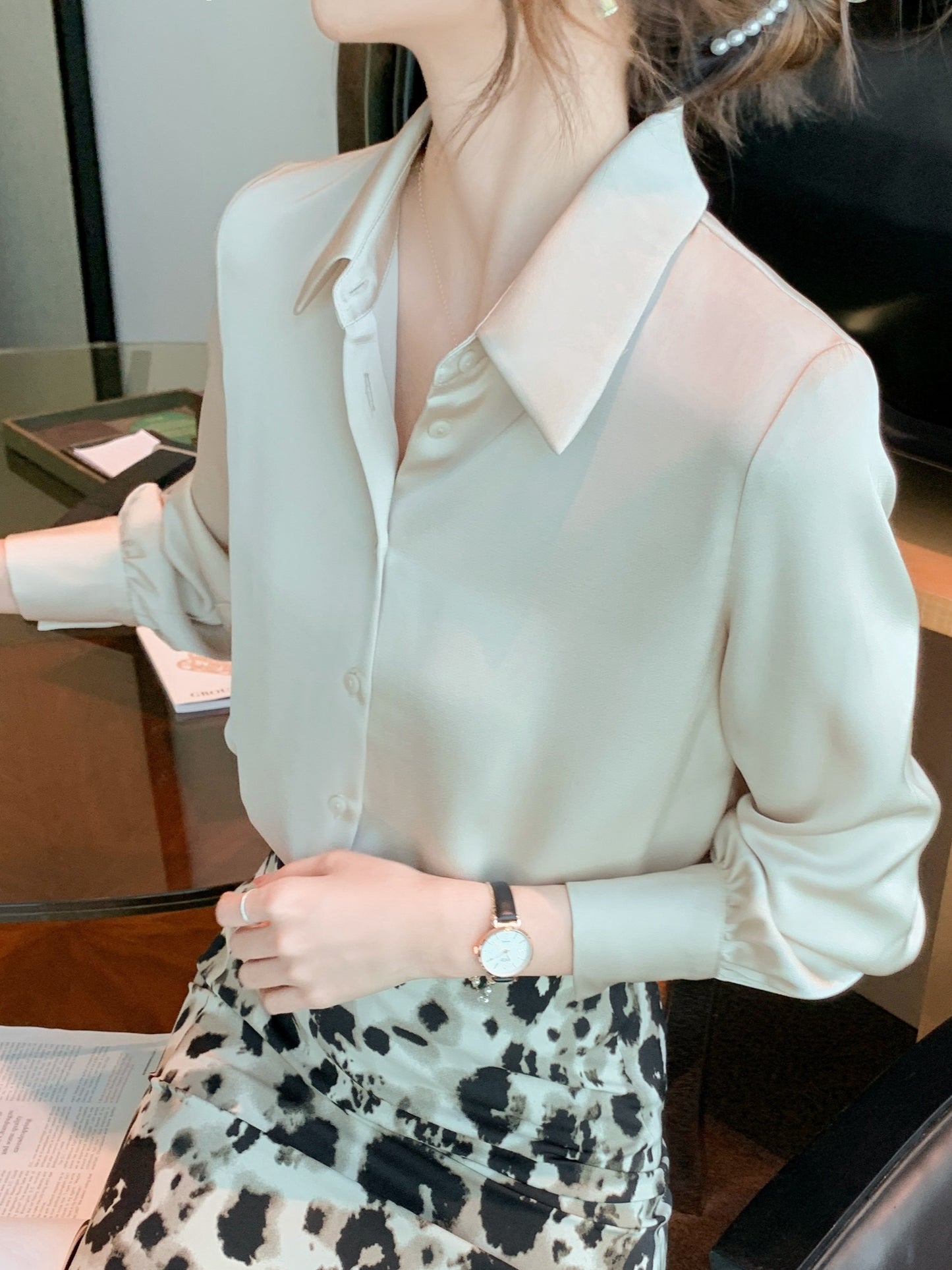 Women's chic solid color long sleeve blouse made of 100% polyester with lapel collar and button details. Suitable for all seasons.