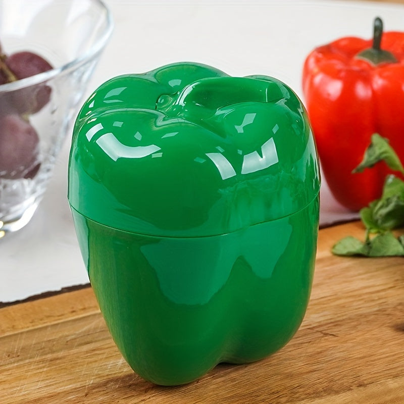 Food storage container in the shape of a green pepper, made of reusable and hand-washable plastic with a flip-top lid. Perfect for storing fresh veggies and other items in the kitchen. Can be used as a multifunctional organizer on the countertop.