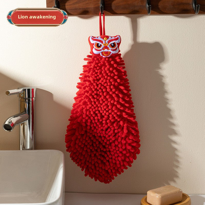 Red chenille hand towel for kitchen and bathroom décor with festive hanging design.