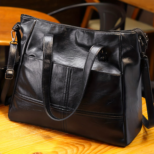 Fashionable black quilted shoulder bag with removable strap, large capacity, anti-theft zipper closure, polyester lining, and clutch accessory - ideal for stylish commuters.