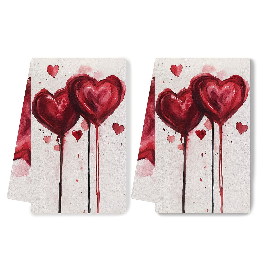 Two pieces of ultra soft kitchen towels featuring a Valentine's Vibes heart design. These towels are highly absorbent, machine washable, and perfect for drying dishes. With a contemporary style, they measure 40.64x60.96 cm each.