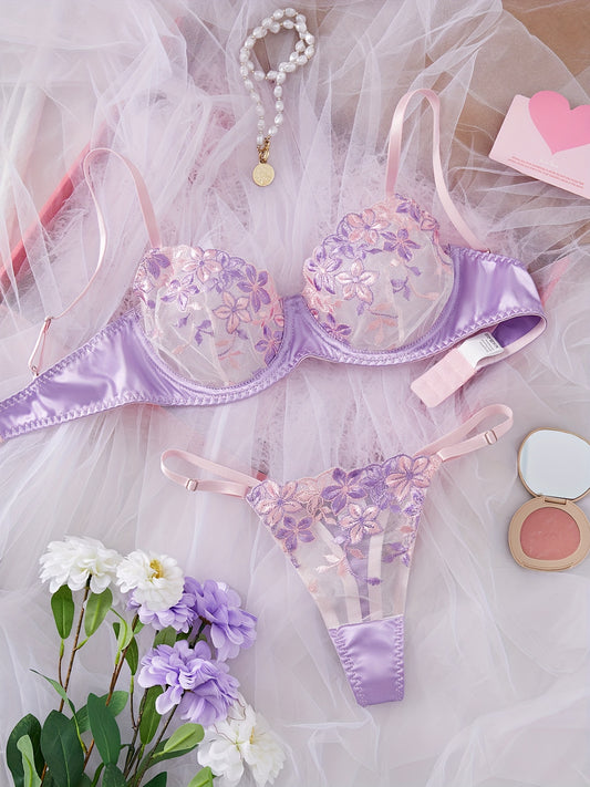 Women's sexy lingerie set featuring a flower design bra and thong.