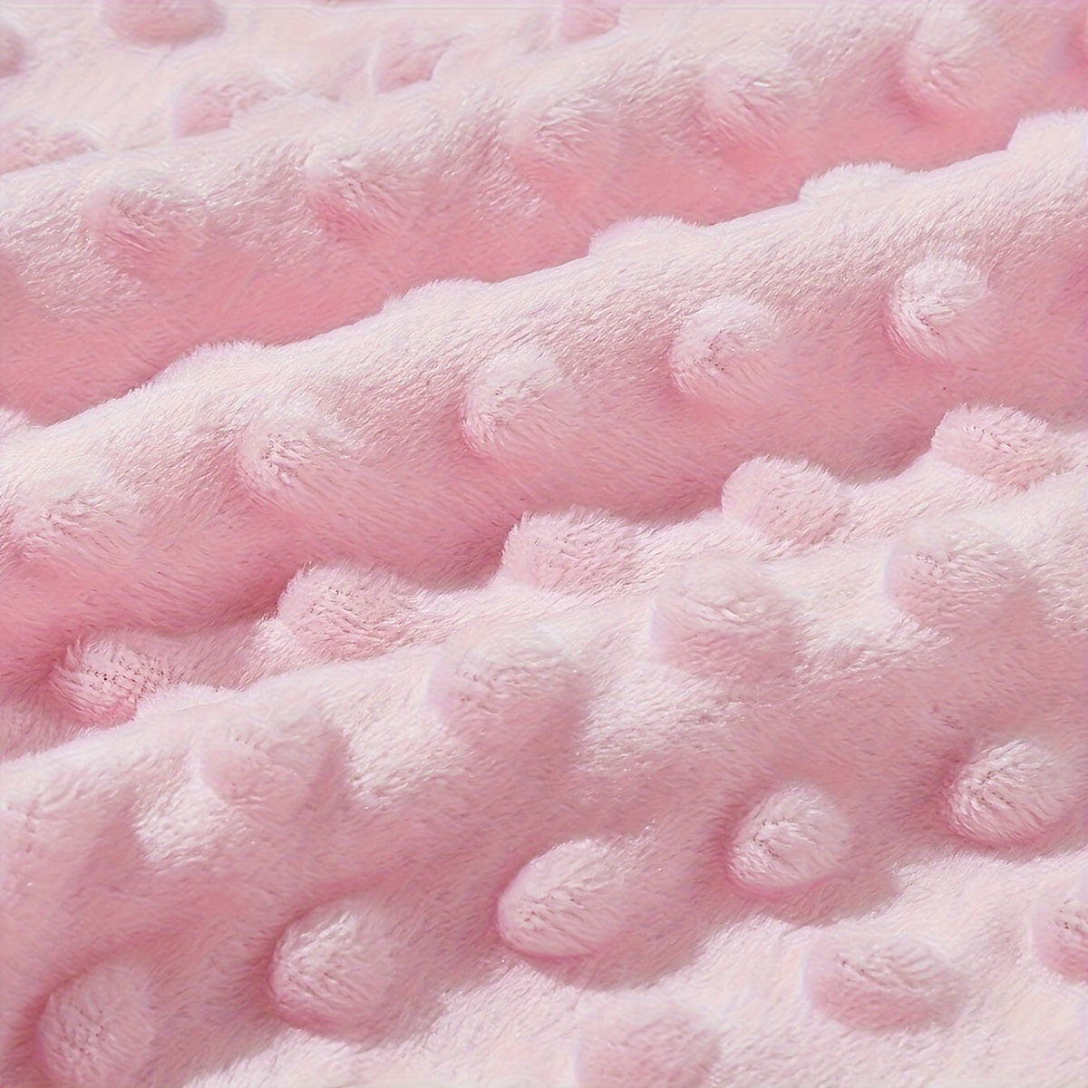 Soft polyester baby swaddle blanket featuring a woven pink, blue, and white dot pattern. This versatile infant wrap is perfect for all seasons and provides soothing comfort for your baby.