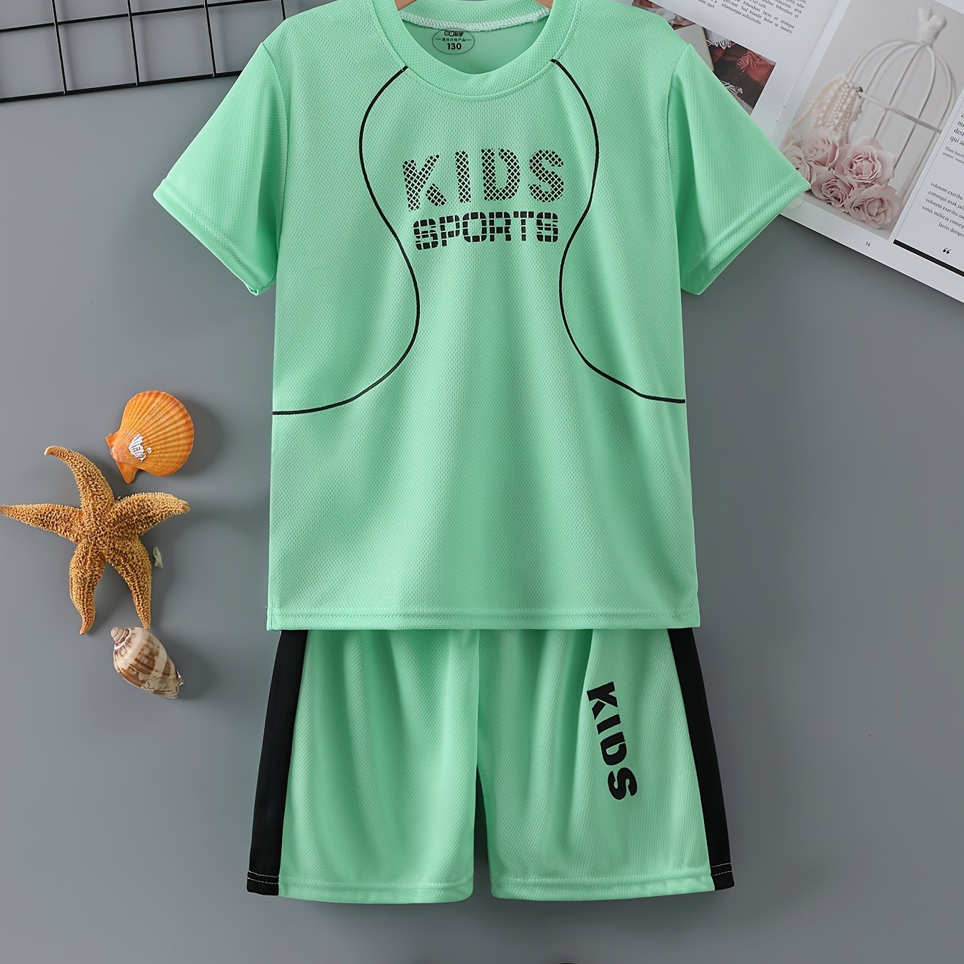 Children's quick-drying sports suit with short-sleeved shorts and KIDS SPORTS printed t-shirt, made with lightweight and comfortable quick-drying fabric.