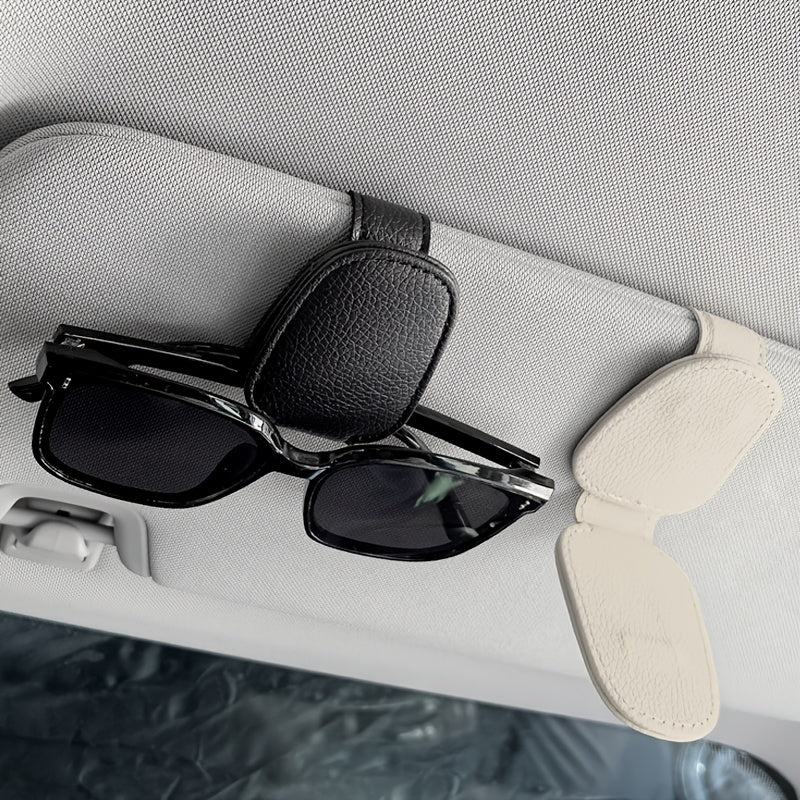 Universal car sun visor clip made of PVC material for storing eyeglasses in the vehicle interior.