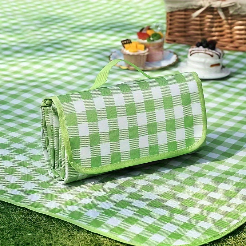 Waterproof picnic blanket with portable storage bag made of durable non-woven fabric. Foldable and moisture-resistant mat perfect for camping, beach, and outdoor activities. Features