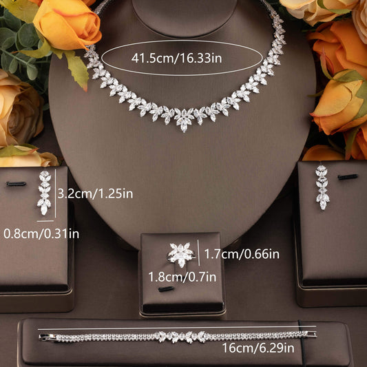 Exquisite set of jewelry adorned with cubic zirconia leaf detailing, including a necklace, earrings, ring, and bracelet, designed for women to enhance their ensemble for weddings and galas.