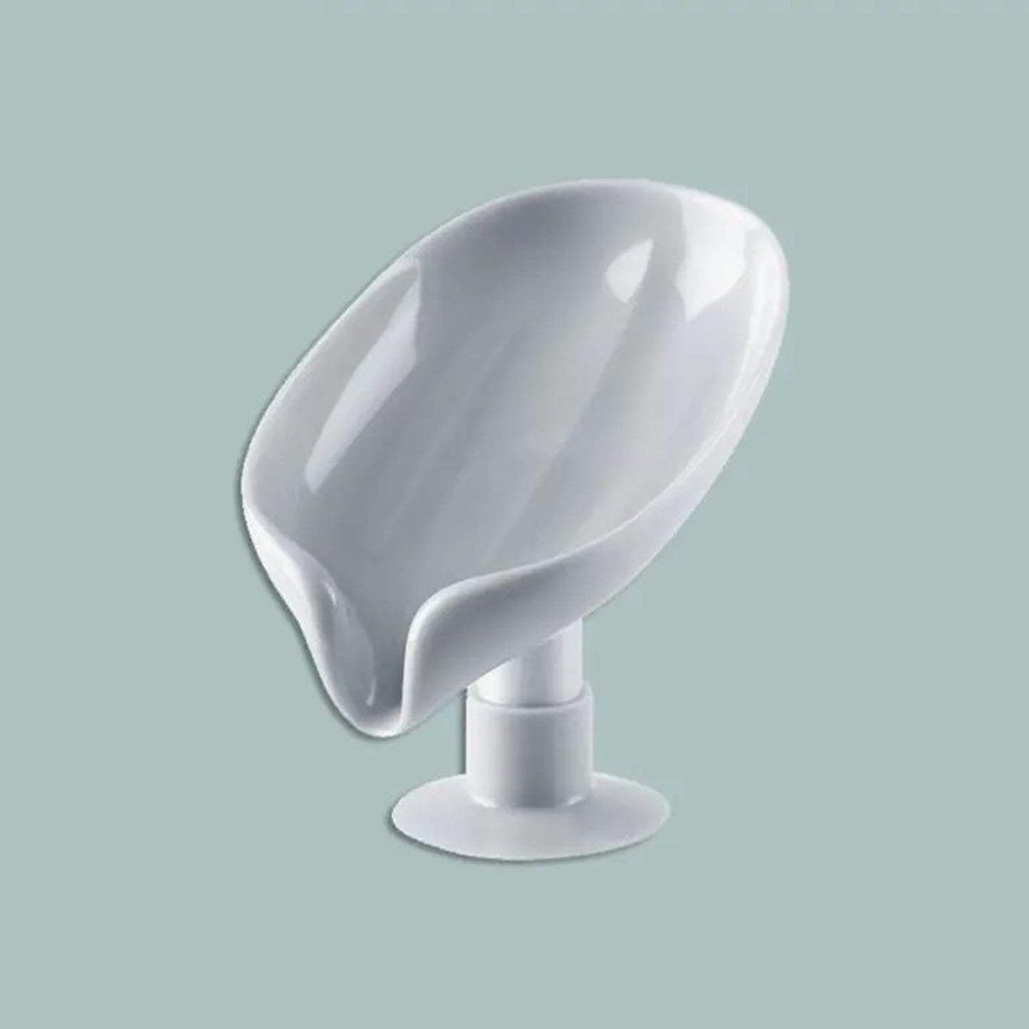 Leaf-shaped soap dish with strong suction and drainage in green/gray color, does not require electricity, enhances bathroom decor, keeps soap dry.