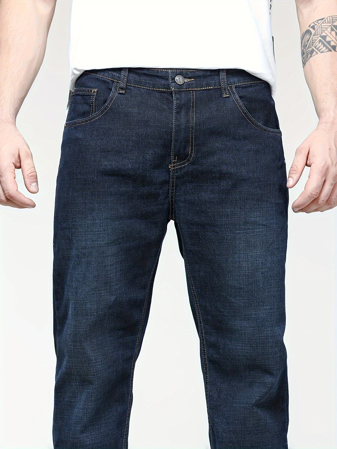 Men's solid denim pants for spring and fall in plus sizes.