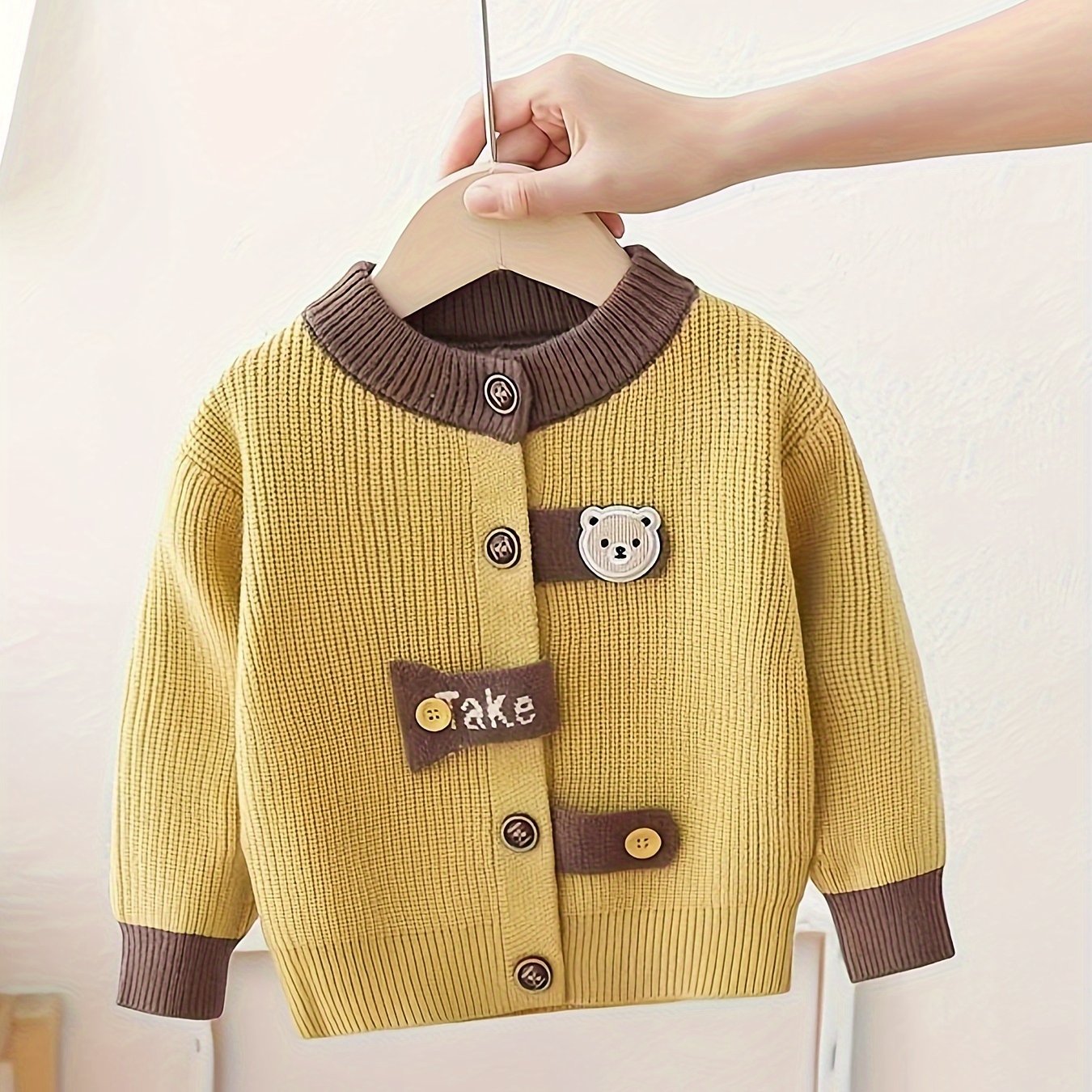 Cute boys' mustard yellow cardigan with bear patch. Cozy knit outerwear, perfect for fall/winter.