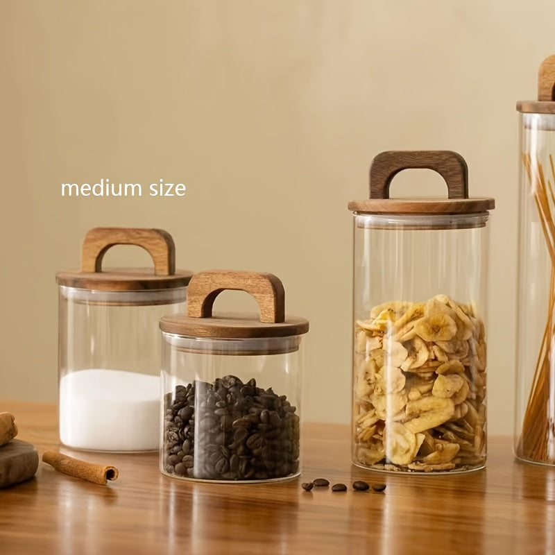 Glass storage jar with a wooden lid and a capacity of 27oz/800mL. This multi-purpose jar is freezer safe and should be hand washed only. Perfect for storing coffee, tea, or food.