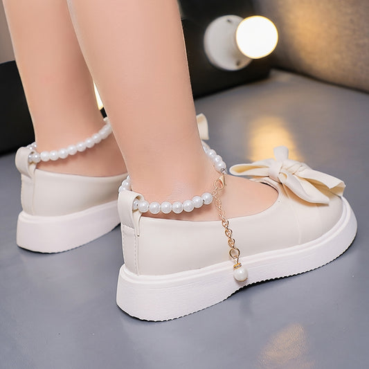 Stylish Mary Jane shoes for girls with pearl bowknot decoration, perfect for parties and special occasions.