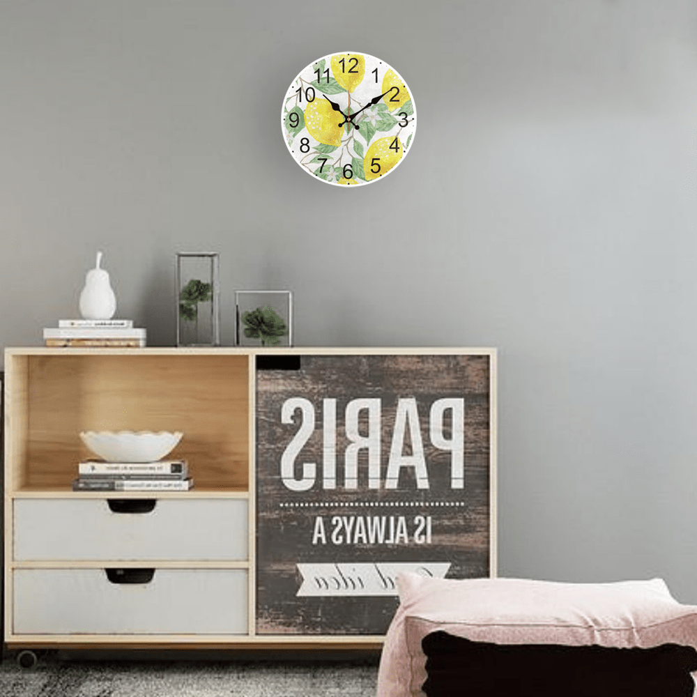 Fruit theme wall clock with golden lemon pattern design, silent non-ticking, AA battery operated. Ideal for living room and kitchen decor.