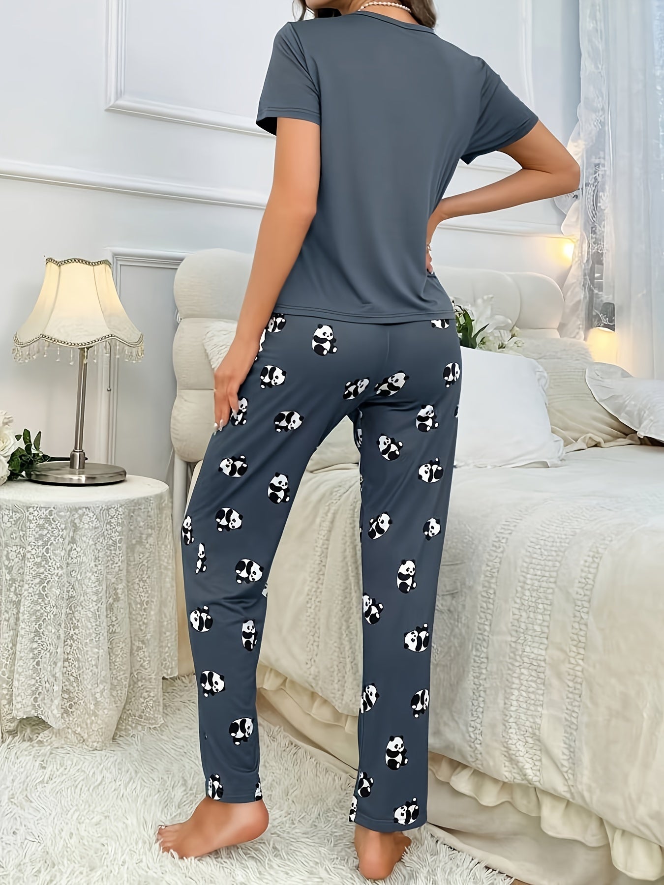 Women's cute panda print pajama set in dark gray, made of soft polyester and elastane blend. Features short sleeve crew neck top and long pants. Machine washable.