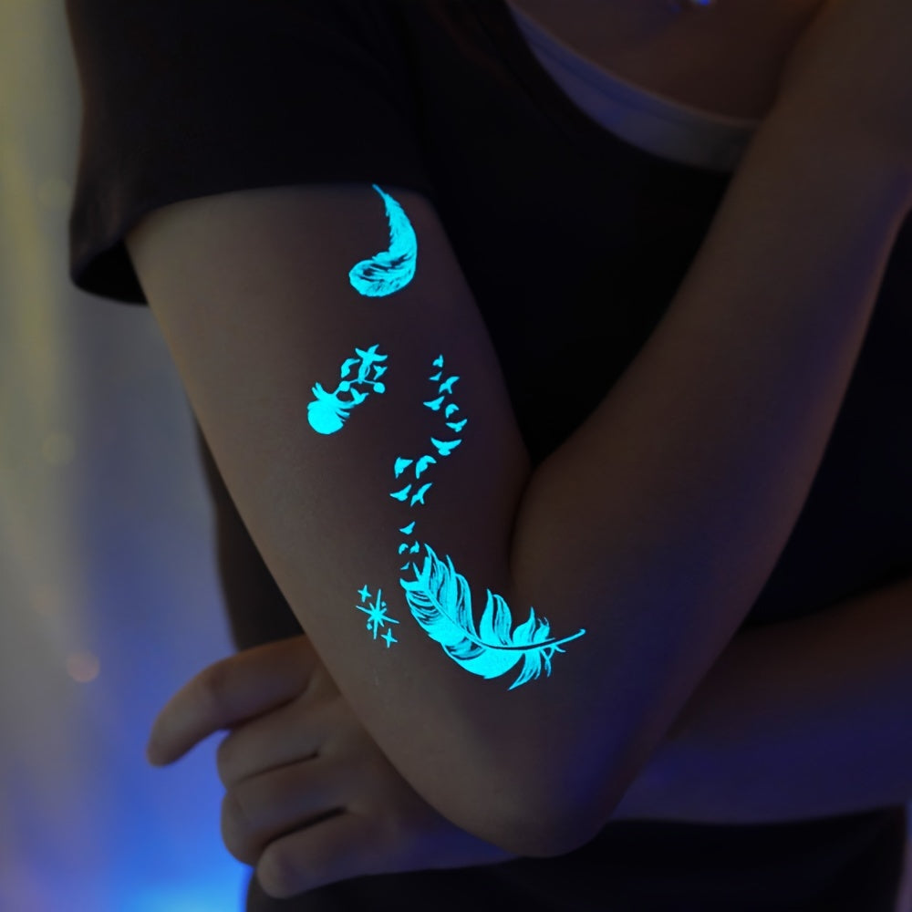 Blue luminous feather and snake tattoo stickers for women and girls, featuring white design. Fake bracelet, necklace, and face, chest, arm, hand, and finger tattoos that glow in the dark.