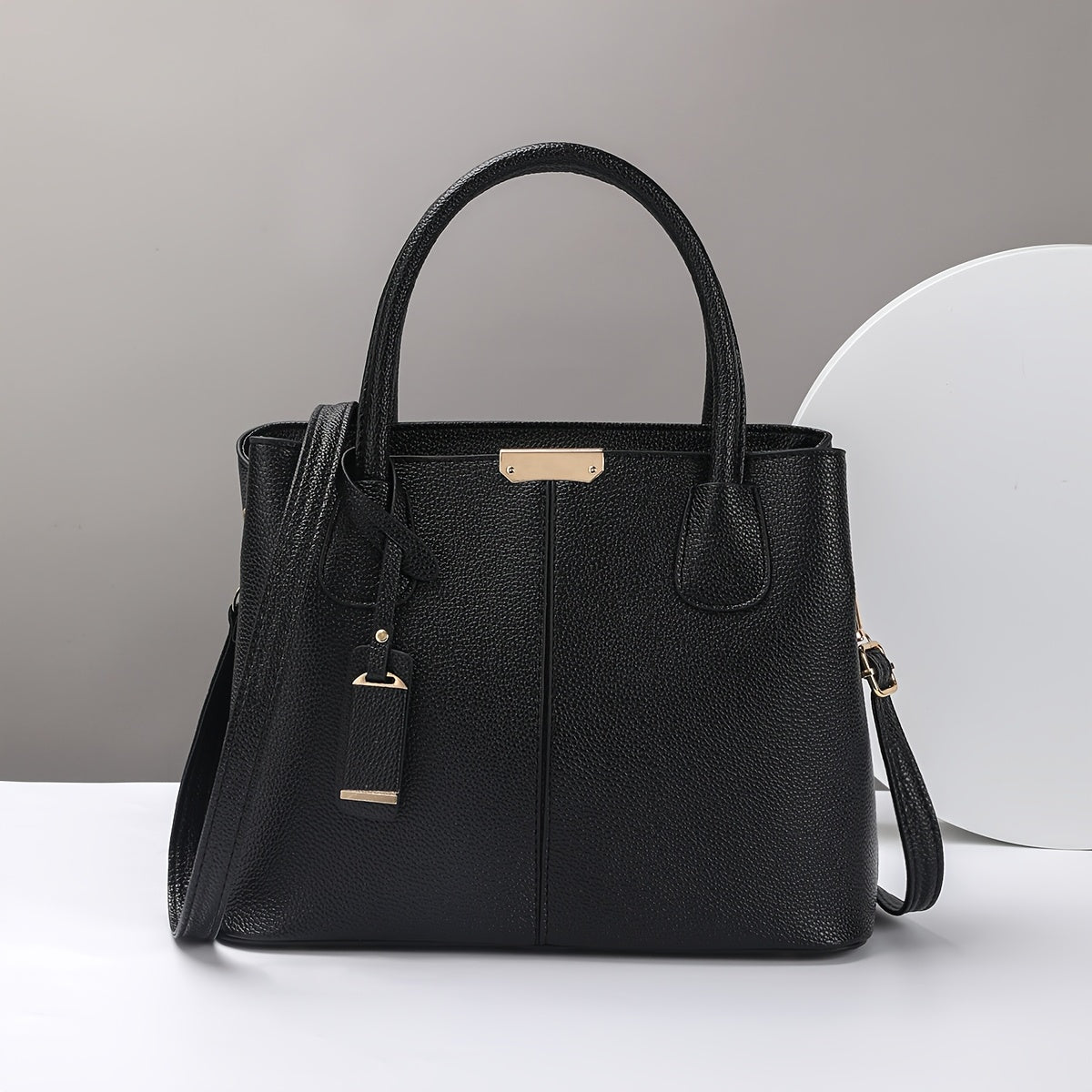 Stylish black quilted tote bag for women, with versatile crossbody and shoulder straps, golden-tone hardware, polyester lining, and zip closure - perfect for daily commuting.