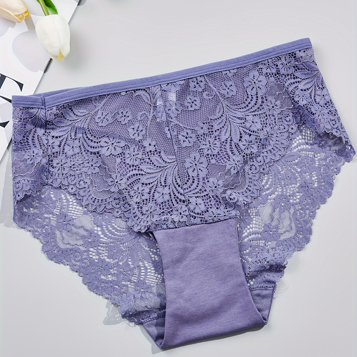 1 pair of women's lace-trimmed brief panties made from soft, breathable nylon blend for everyday wear, sleep, dates, and light sports. Cute and semi-transparent design.