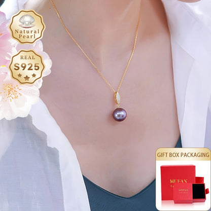 This stunning pendant necklace features a 13-14mm round natural freshwater pearl in an elegant shade of purple. The gemstone may have minor imperfections, adding to its unique beauty. The pendant is crafted from S925 silver and comes with a gift box