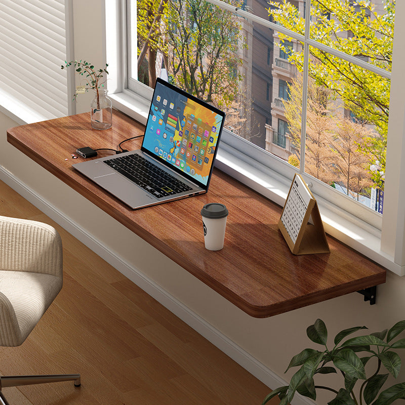 White wooden wall-mounted folding desk with adjustable computer monitor and laptop stand made of cork material, perfect for home and office organization in kitchens and dorms.