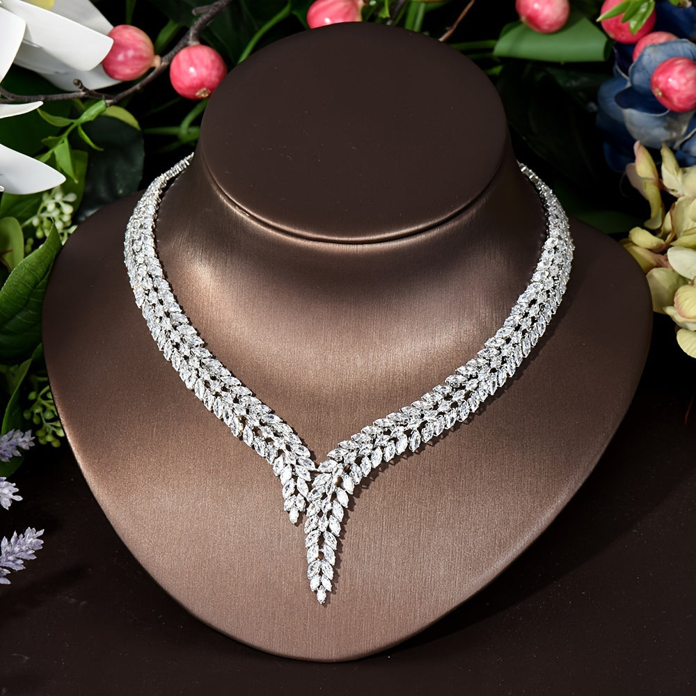 Elegant Leaf-Shaped Jewelry Set with Sparkling Zirconia, 18K Gold Plated Copper. Includes Earrings, Necklace, Bracelet, and Ring. Perfect for Weddings, Parties, and Bridal Wear.