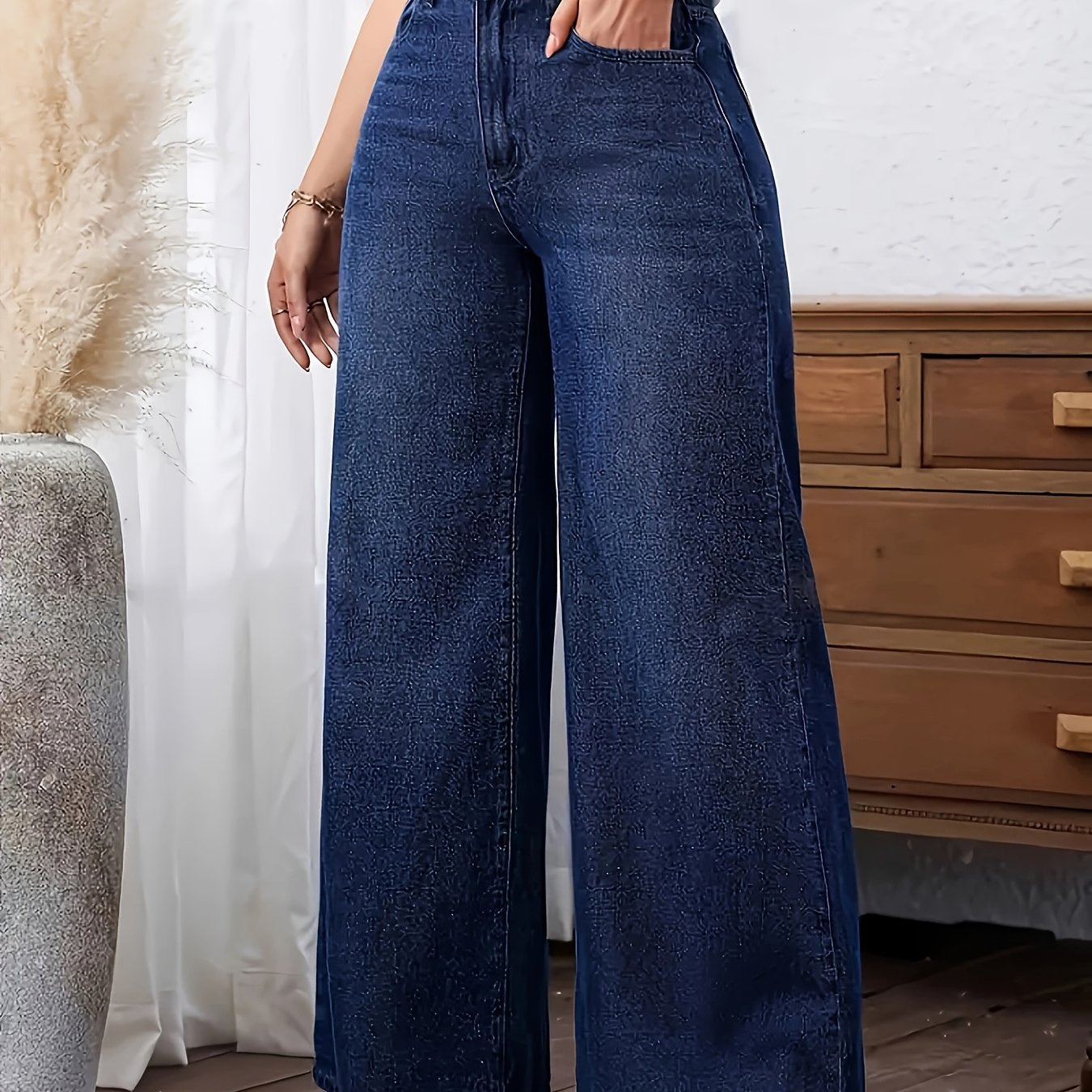 Women's plus size denim jeans with straight leg, solid color, medium stretch, washed fabric, and wide-leg design suitable for all seasons.