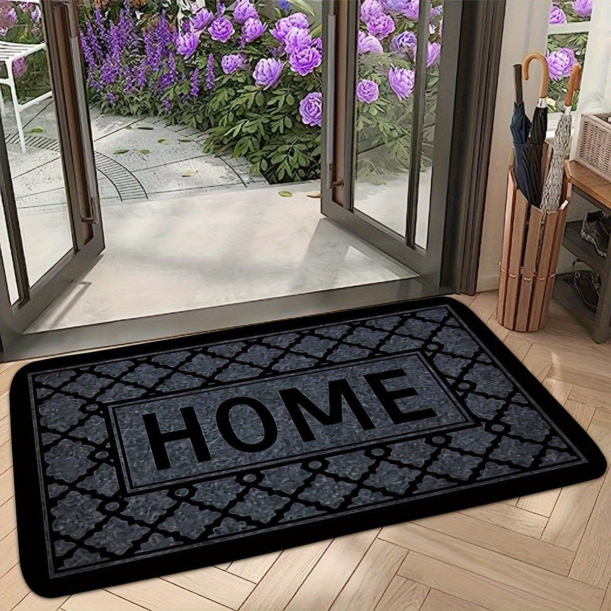 This kitchen flooring mat features a striking black foam design with irregular stripes and the word "HOME" pattern. Made of soft, thick flannel material, this non-slip mat is constructed from 1.2 foam sponge, making it ideal for bathroom and indoor