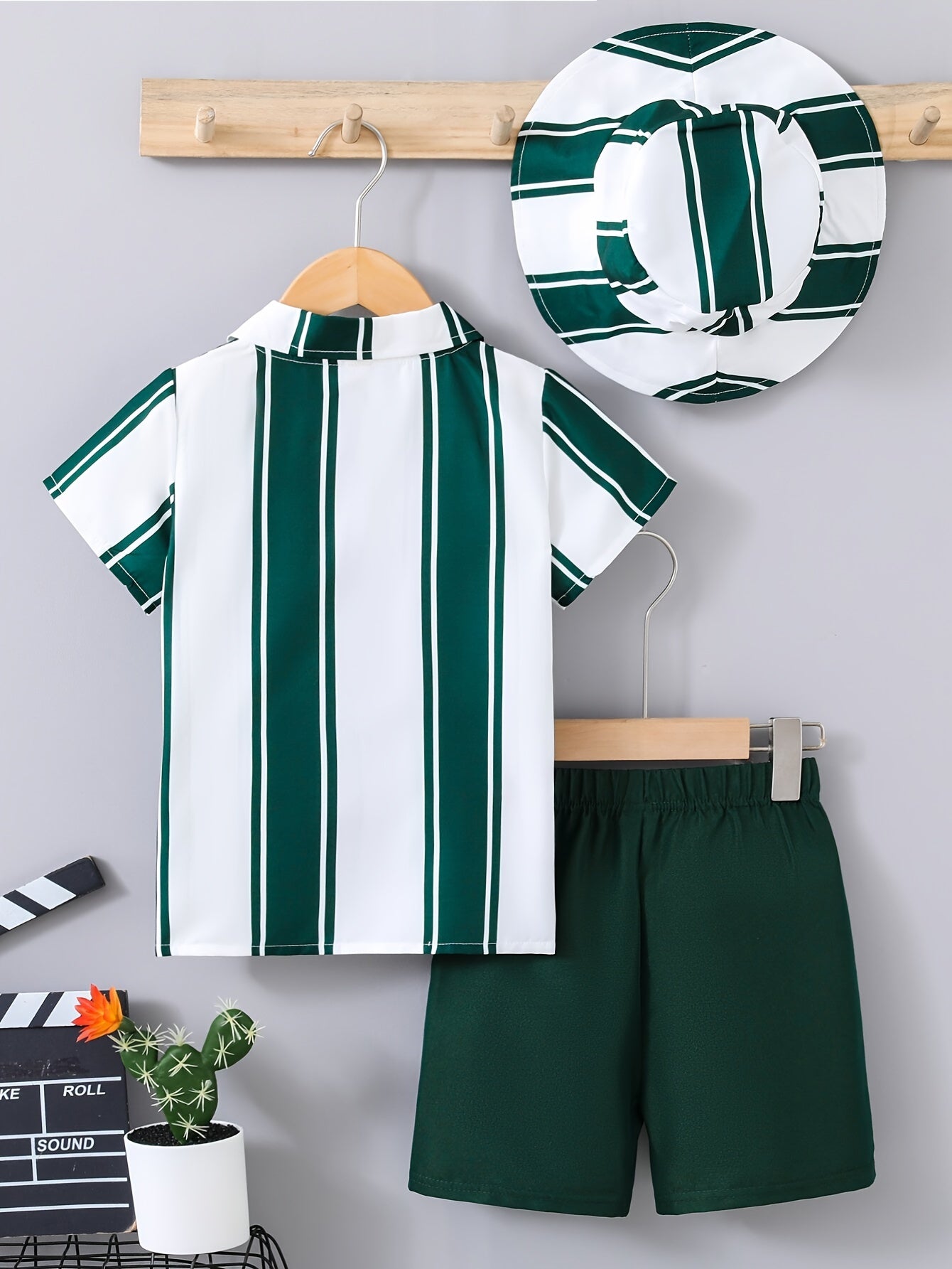 3-piece casual summer outfit for boys includes striped shirt, pocket shorts, and hat.