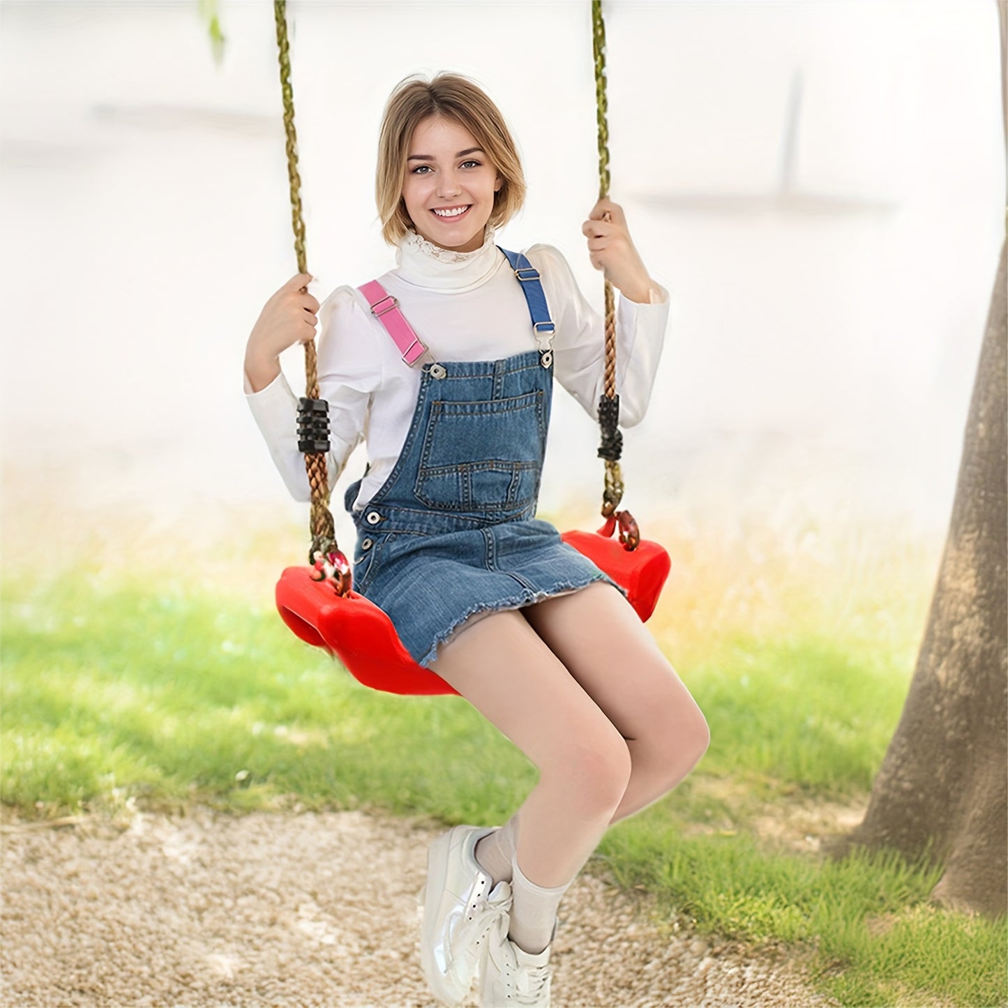 Adult-sized plastic sling swing chair, ideal for outdoor courtyard entertainment, with adjustable soft rope.