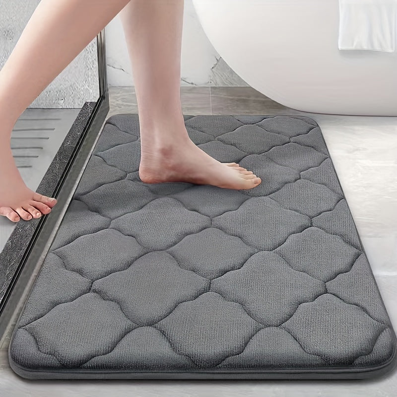 Soft plush bathroom mat with non-slip, absorbent, and machine washable features. Made of cozy coral fleece with a cute short pile design for a comfortable toilet experience.