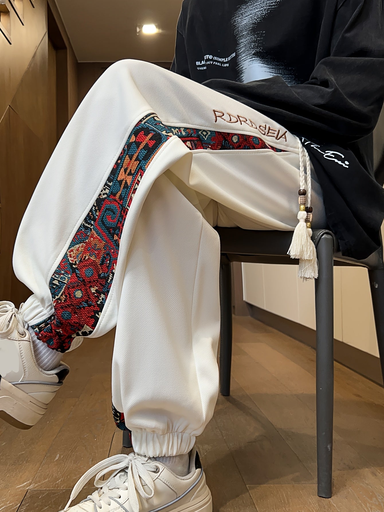 Men's stylish long pants with ethnic style patchwork and letter embroidery, casual jogger sports trousers.