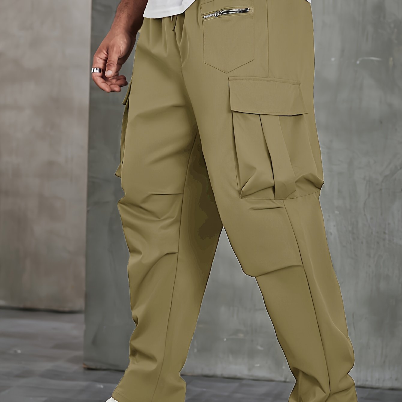 Men's solid cargo pants in plus sizes for spring and fall outdoor sports.