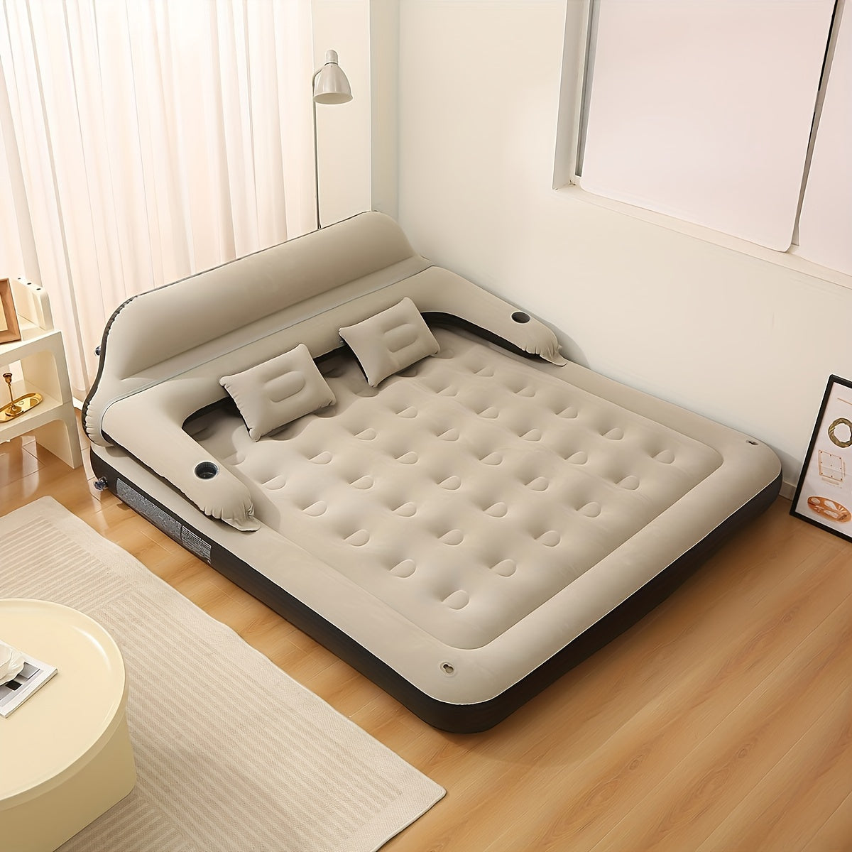 Air mattress with headboard, blow-up sofa bed, for indoor and outdoor use.