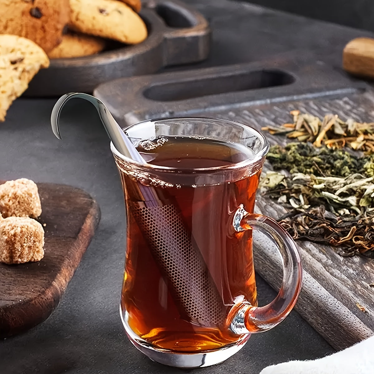 Ideal for tea enthusiasts, this stainless steel tea infuser features a pipe-shaped design with a convenient handle for easy brewing in cups and teapots. Perfect for loose leaf tea, this strainer is a must-have accessory for gourmet tea lovers.