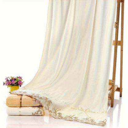 4-piece lace embroidery towel set includes 2 bath towels and 2 hand towels. Soft and absorbent, perfect for bathrooms.