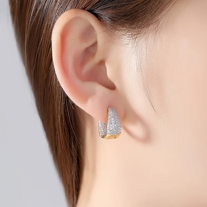 Stylish and versatile earrings adorned with sparkling zirconia, ideal for giving as a gift to friends or loved ones during the holiday season.