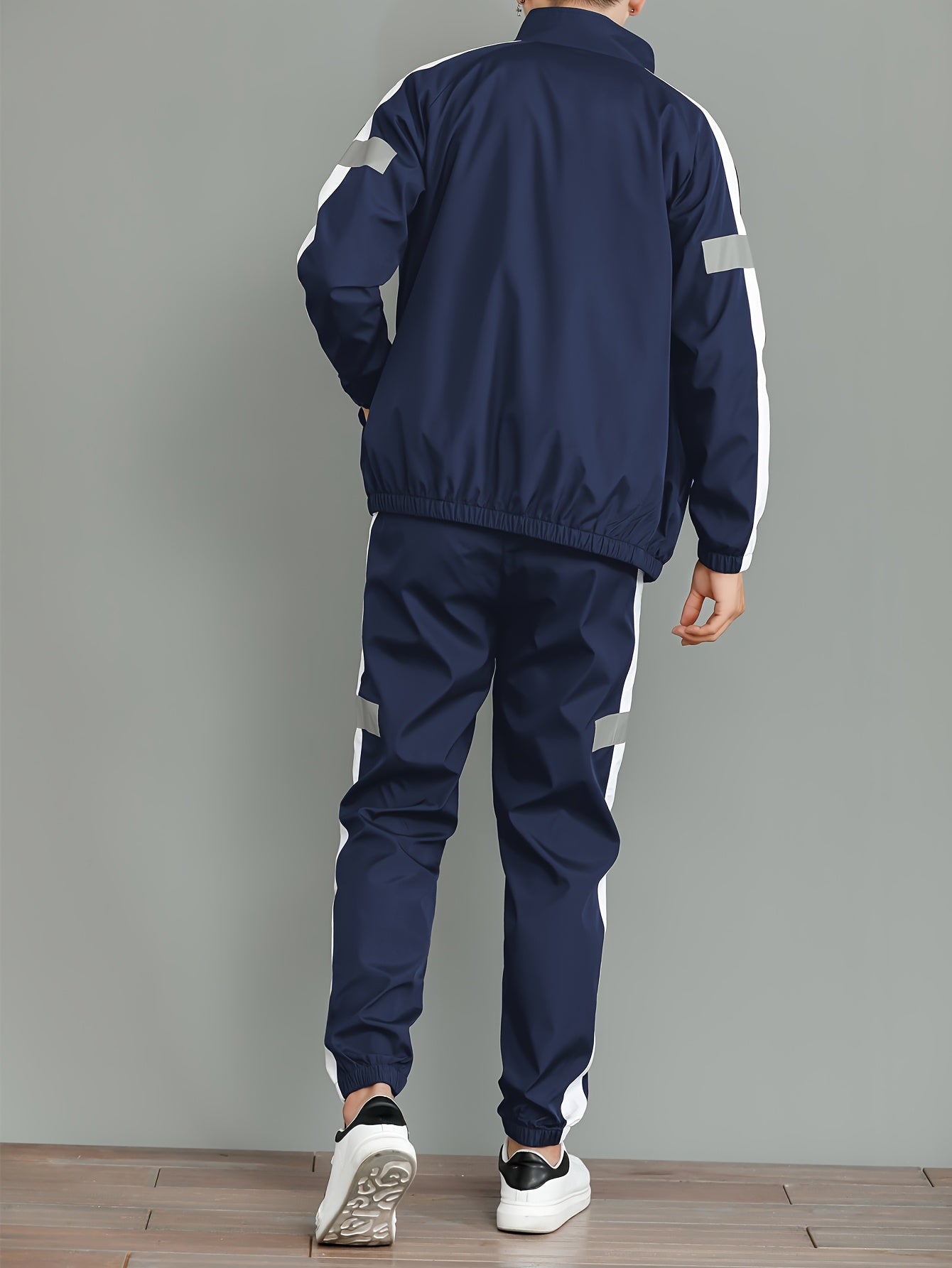 Stylish men's casual set with jacket and loose pants, ideal for spring and autumn activities.