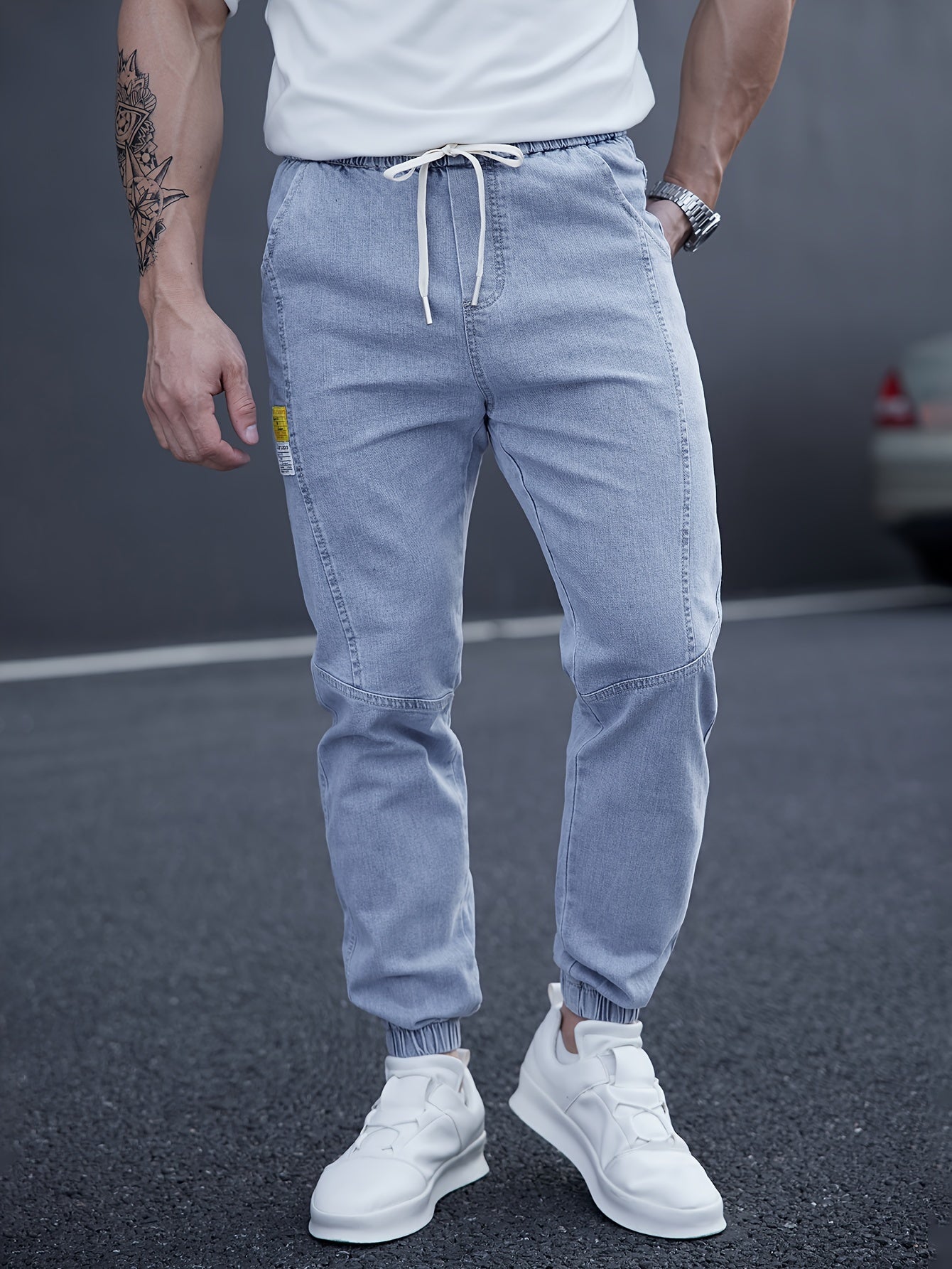 Trendy men's tapered jeans with waist drawstring